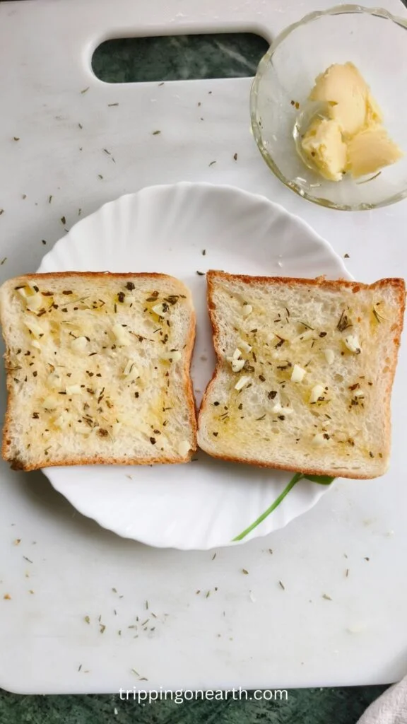 garlic butter mixture spread in raw bread