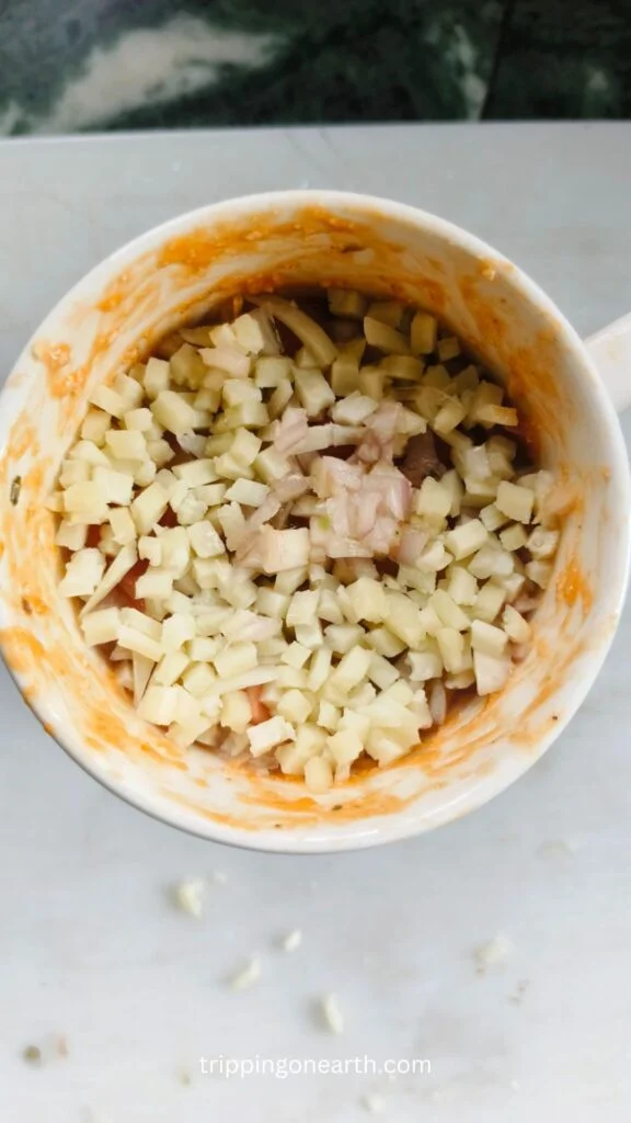 mug topped with shredded mozzarella cheese