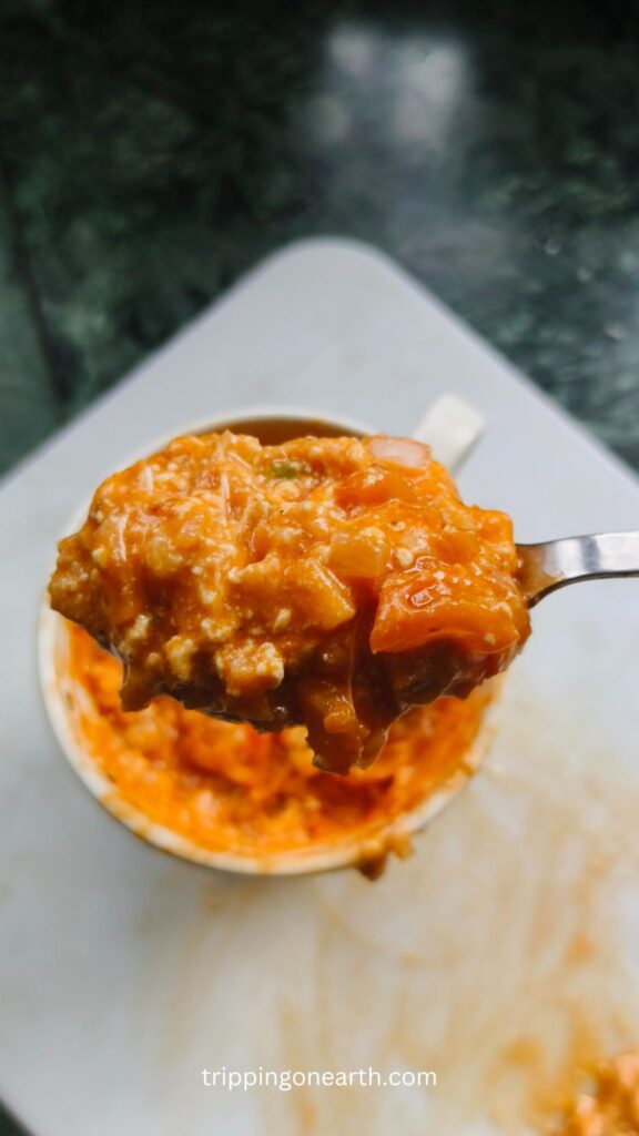 Top view of spoonful of cottage cheese pizza