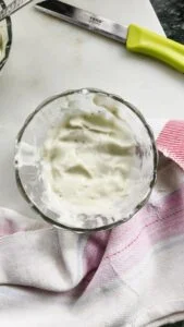 top view of pesto aioli in a glass bowl