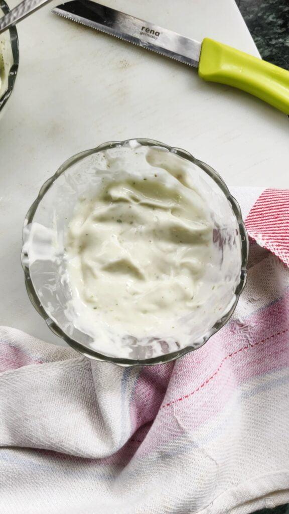 top view of pesto aioli in a glass bowl