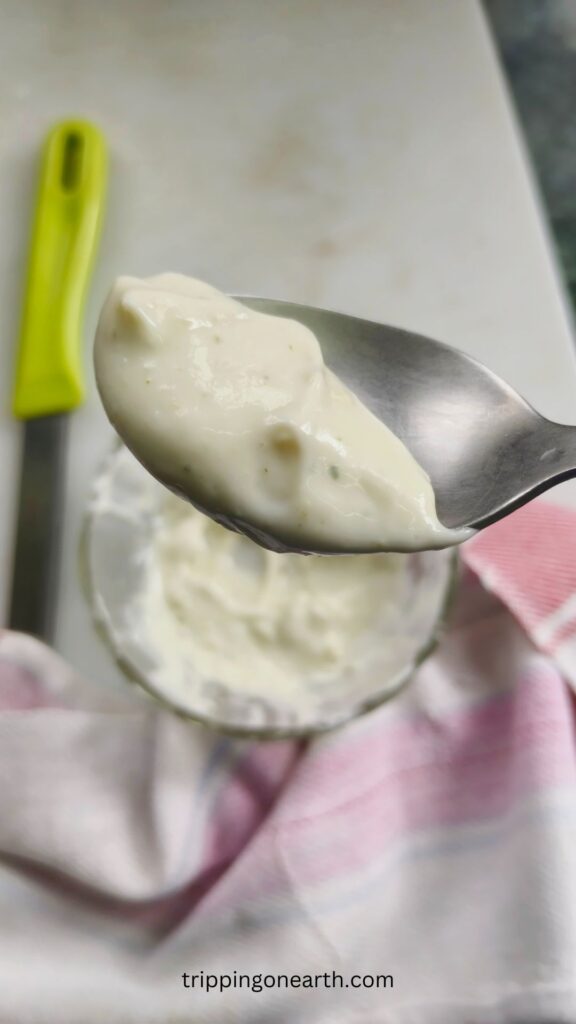 top view of pesto aioli on a spoon