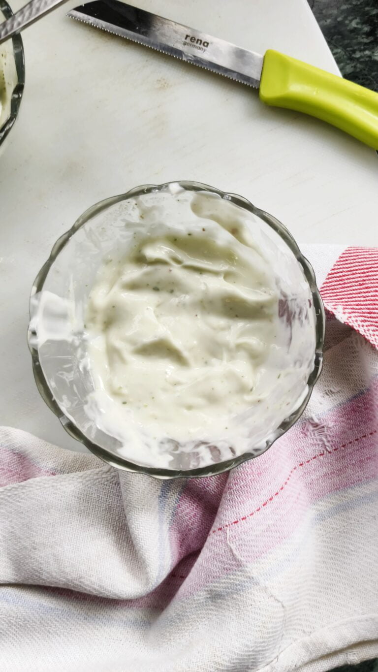 top view of pesto aioli in a glass bowl