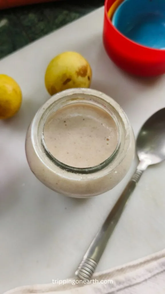top view of apple vinaigrette in a glass jar