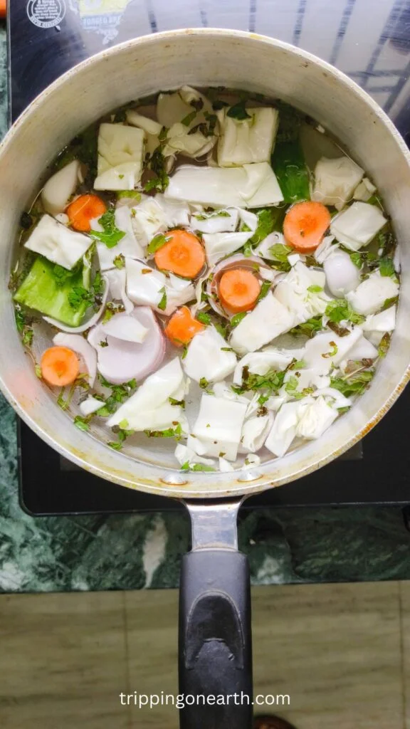 Cut veggies submerged in water in a pot