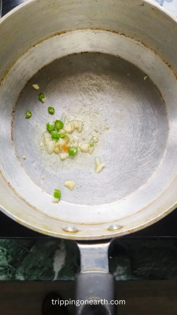garlic and green chilies in a pot