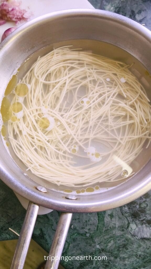 Spaghetti getting cooked in boiling water