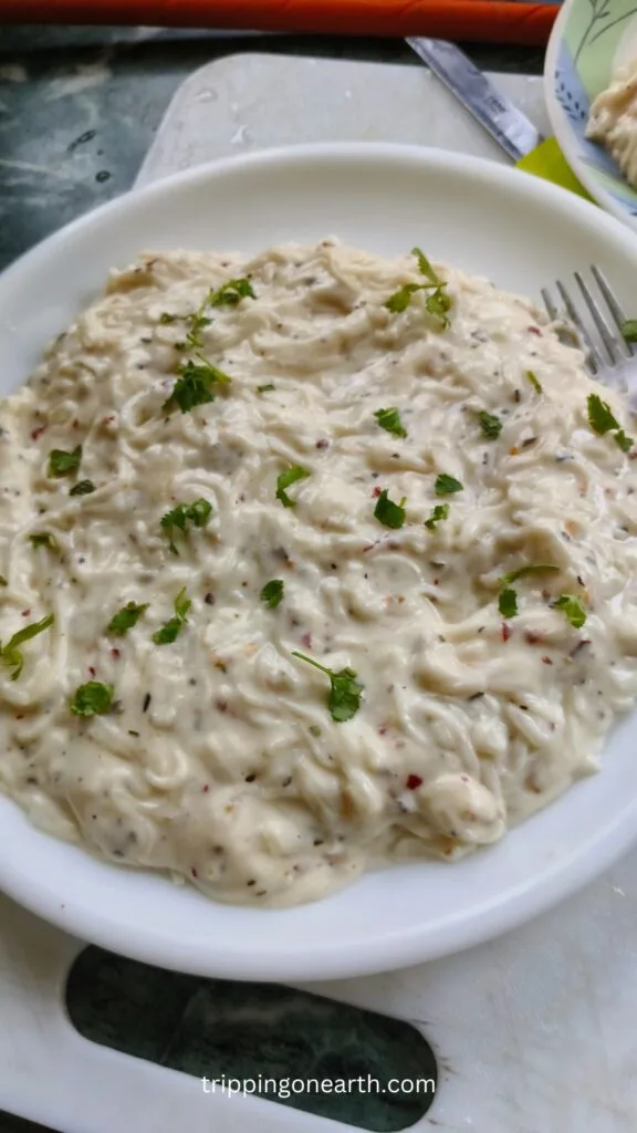 Spaghetti pasta alfredo on a white plate