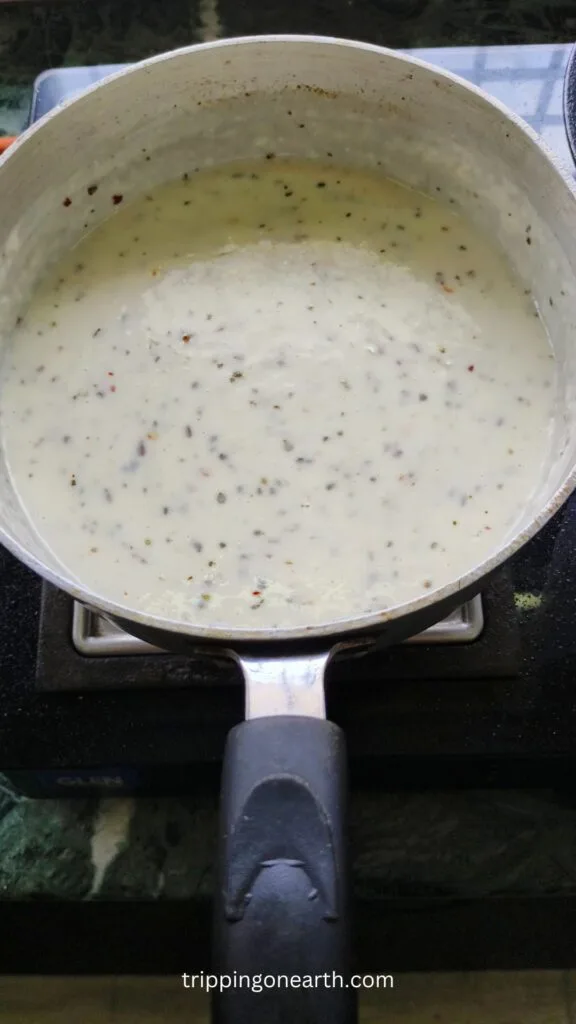 Alfredo sauce in a skillet
