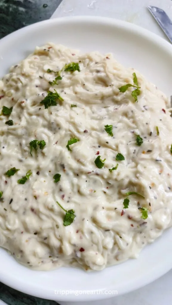 Spaghetti pasta alfredo on a white plate