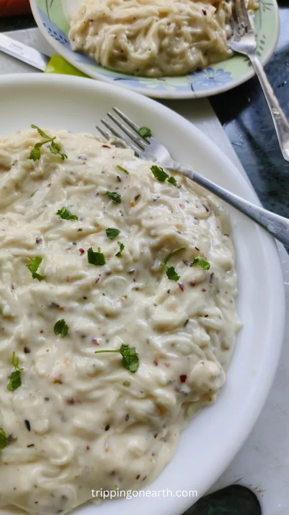Spaghetti pasta alfredo on a white plate