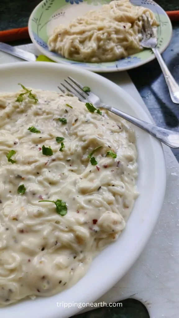 Spaghetti pasta alfredo on a white plate