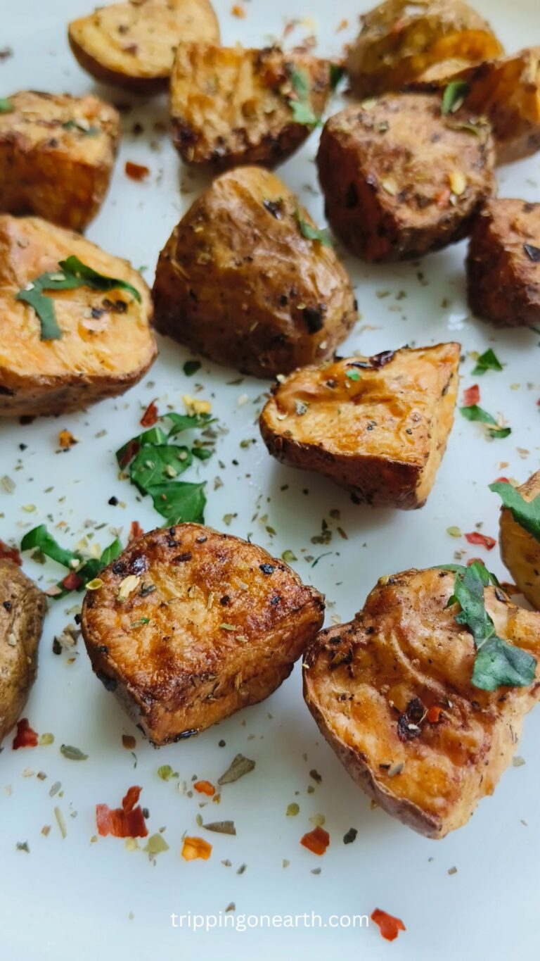 Air fryer potato cubes on a white plate