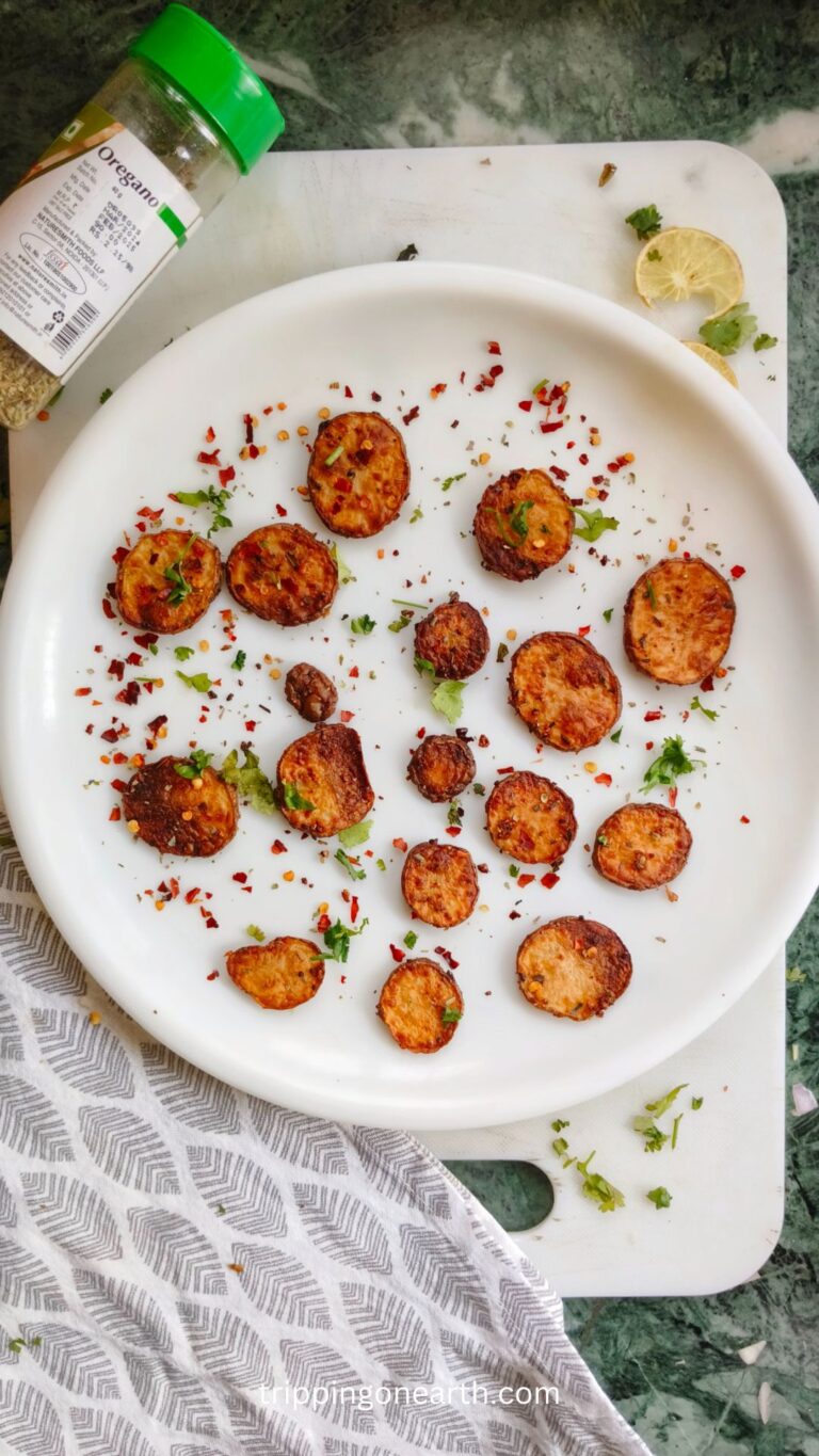 Cooked Sliced potatoes in air fryer on a white plate