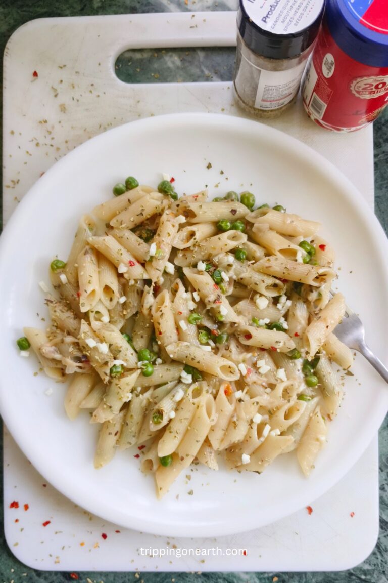 pasta and peas on a white plate