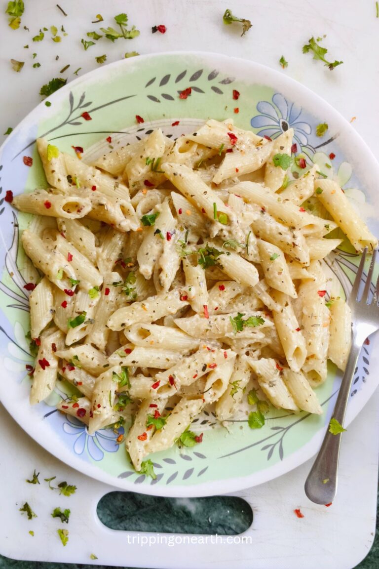 Lemon pepper pasta on a plate along with a fork